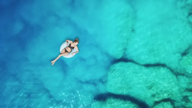woman in bikini relaxing in the sea